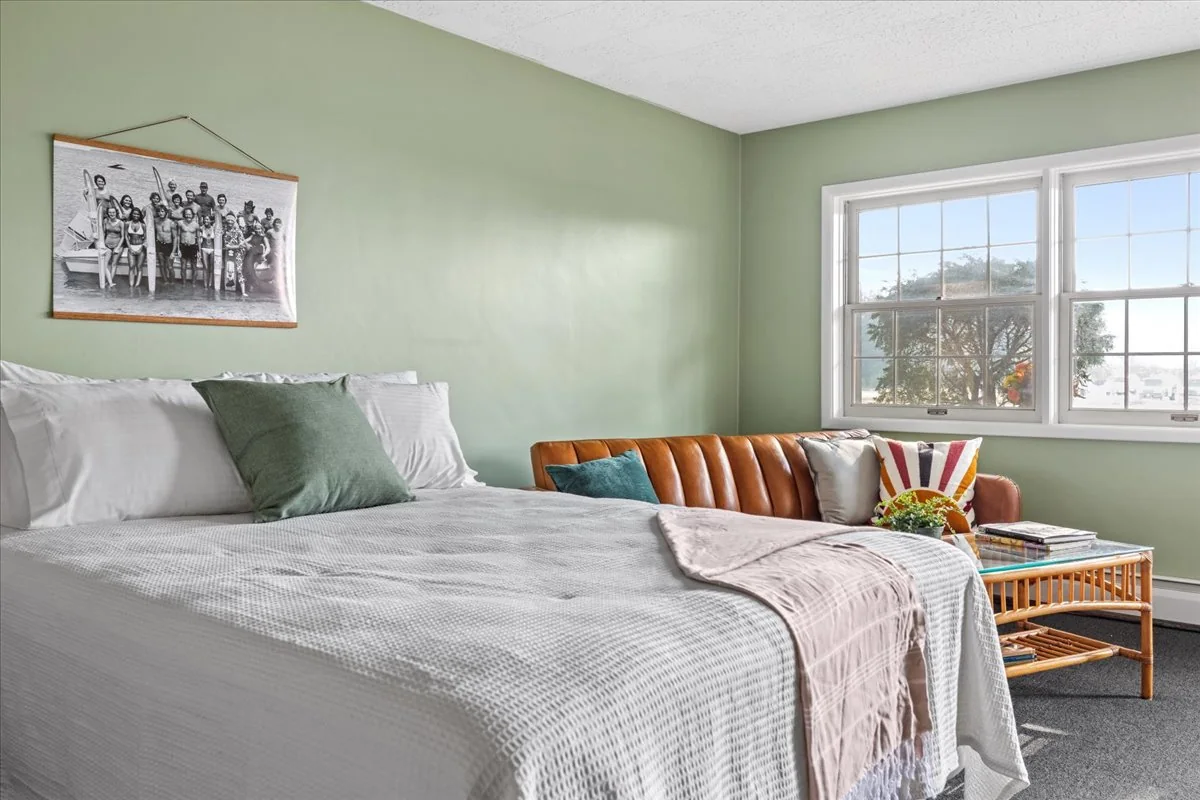 A retro-modern room with a king bed